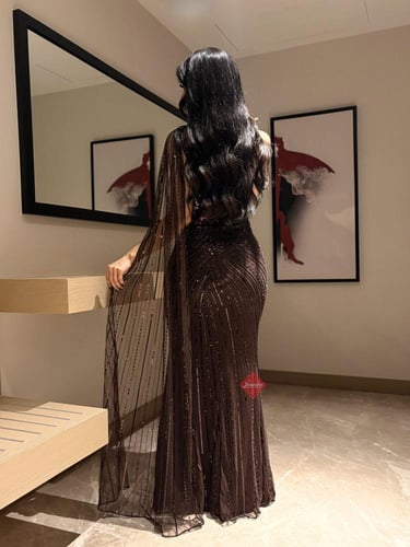 فستان سهرة طويل مطرز بالترتر