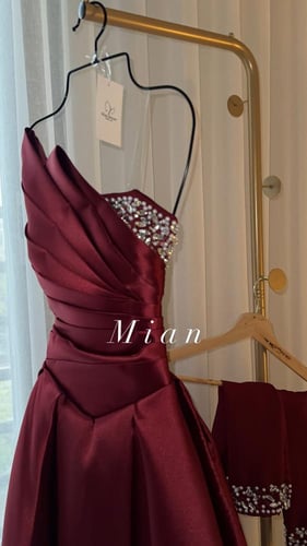 فستان اكرام عنابي