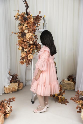 فستان خربزي بياقه شك يدوي