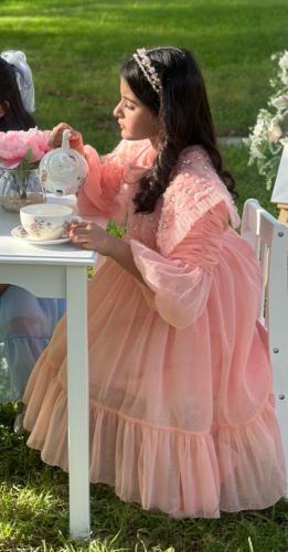 فستان خربزي بياقه شك يدوي