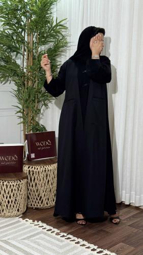 Elegant black women's abaya with a unique insert design by Rawan Al Fareed