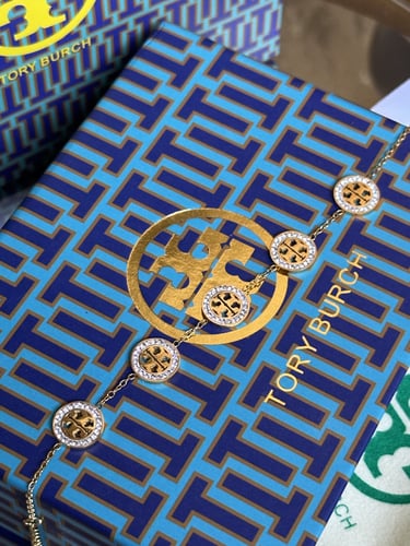 إسوارة TORY BURCH معدن ذهبي