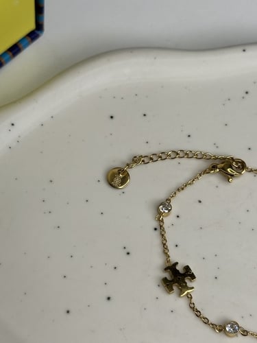 إسوارة TORY BURCH معدن ذهبي