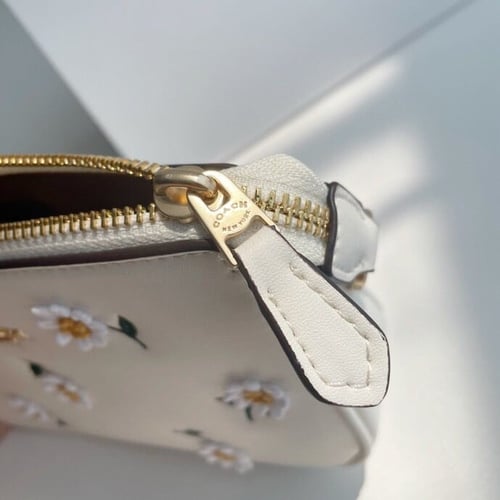 Coach wallet with daisy embroidery
