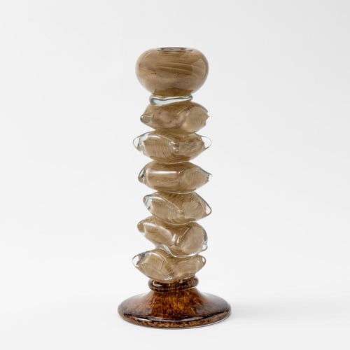 شمعدان زجاجي على شكل احجار بيج وبني