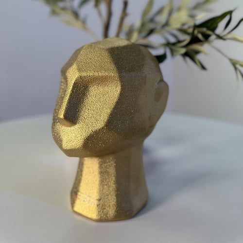 منحوتة على شكل وجه - ذهبي