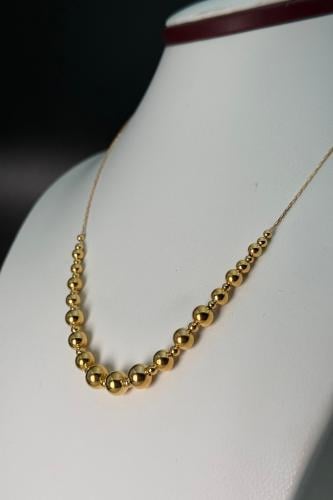 عقد من كرات الذهب