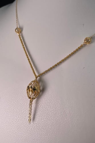 سبحة ذهبية بزخارف كروية عيار 21