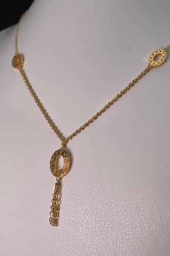 سبحة ذهبية عيار 21 بتصميم بيضاوي