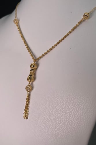 سبحة ذهبية عيار 21 بنقوش زهرية