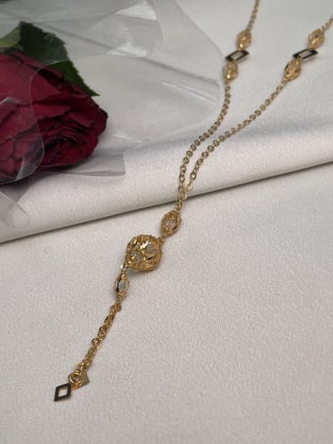 سبحة ذهبية بنقوش كروية ومربعات هندسية عيار 21