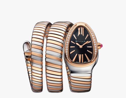 A watch with a double-wrap steel bracelet plated with gold, adorned with diamonds.