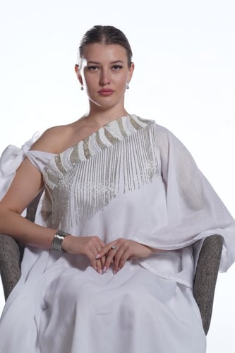 لنن ابيض طبيعي مع كلفة مشكوكة من الشك اليدوي والخر...