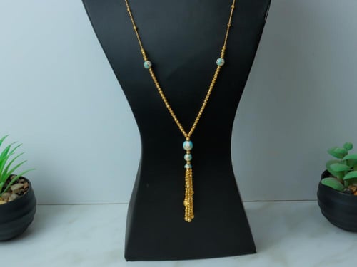 سبحة طويلة ذهب عيار 21 مطعمة بالميناء وزن 15.89 جر...