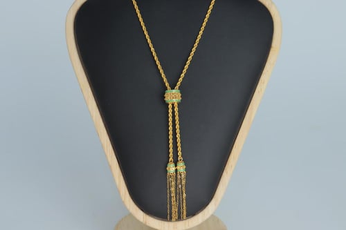 سبحة ذهب عيار 21 مطعمة بالميناء الاخضر الفاتح وزن...