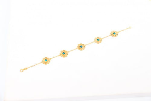 سوارة الرمش خمس وردات باللون الفيروزي عيار 21