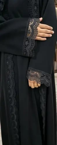 Black abaya, fabric of elegance, from me, dead, with embroidery on the front, sleeves, and the head covering.