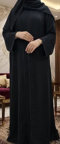 Elegant black abaya with delicate embroidery, inte...