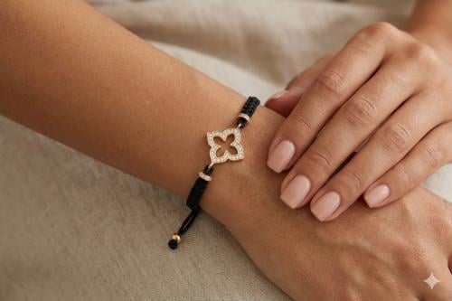Silver bracelet coated with black thread