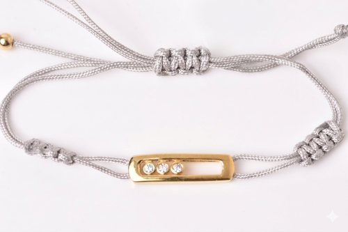 Fine silver bracelet with gray thread, gold-plated...