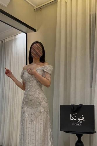 Off-white luxurious dress with embroidered fabric