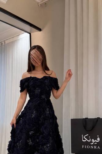 Navy blue dress with off-shoulder design highlighting the shoulders