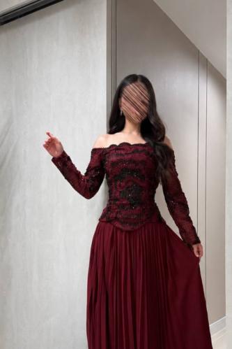 A ribbed dress with an off-shoulder design and long sleeves