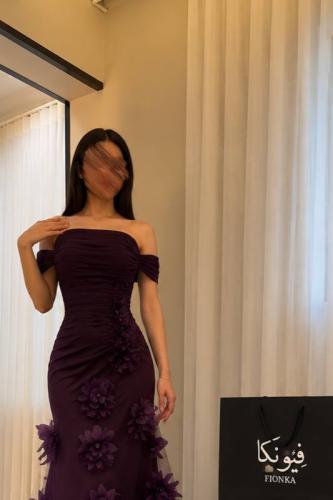 A royal purple dress with a feminine off-shoulder design