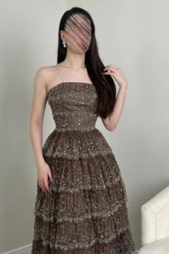 A long dress in shiny chocolate brown color
