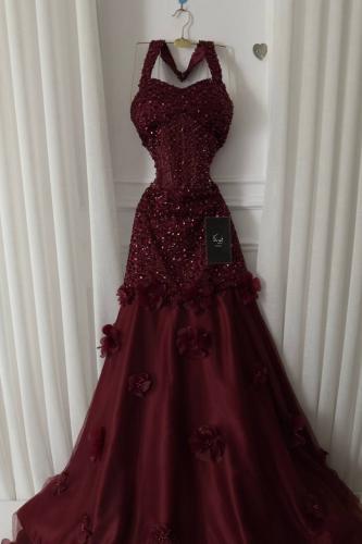 A rose-colored dress with dense embroidery