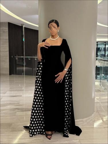 A black dress characterized by long sleeves