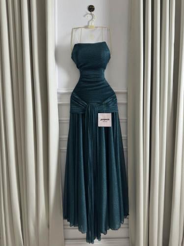 A shiny emerald evening dress – luxurious drape design from Shomos store