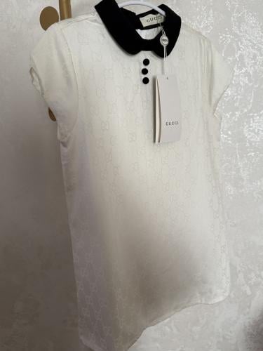 Gucci white dress with the brand pattern all over...