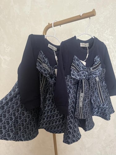 فستان ديور مزين بفيونكة كبيرة