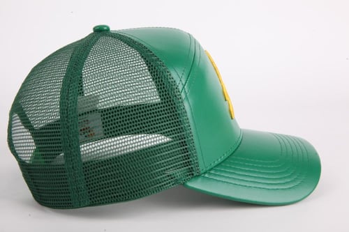 قبعة العملة (جلد)