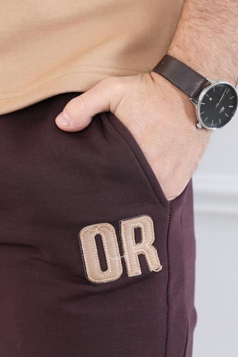 طقم رجالي اوفر سايز نص كم بنطال طويل مزين بطبعة بأ...