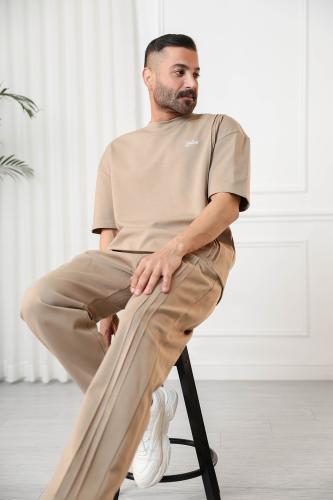 Men's oversized set, short sleeves, long pants, round collar, decorated with raised vertical lines on the T-shirt and pants