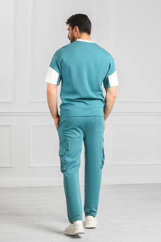 طقم رجالي نص كم بنطال طويل بجيب جانبيه وتيشرت مزين...