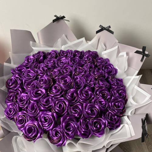 A bouquet of 50 roses, color and packaging accordi...