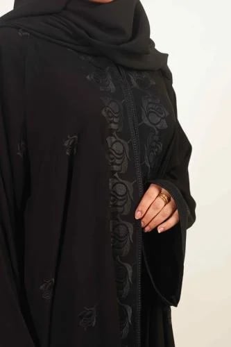 A wide abaya made of royal fabric in the front and a full abaya with floral embroidery