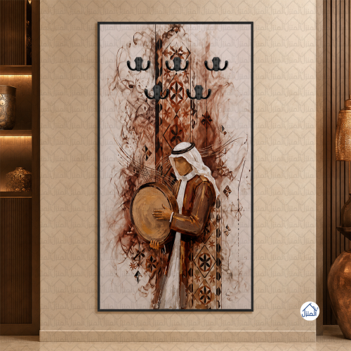 لوحة علاقات عبايات برجل سعودي عازف طبل وزخارف تراث...