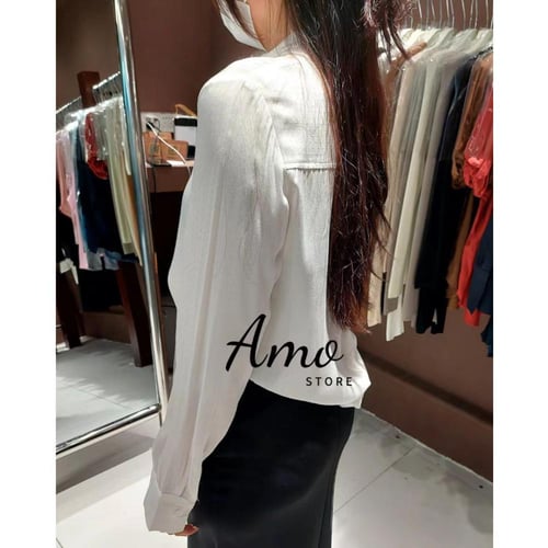 بلوزة بطابع عصري أكمام طويلة بزيادة من الصدر كراف...