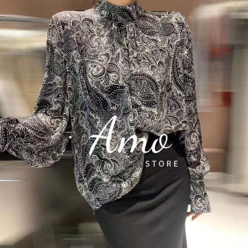 بلوزة انيقة ناعمة بأكمام طويلة مشجرة بأشكال حلزوني...