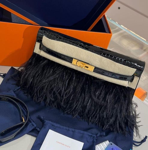 Kelly elan feathers 22cm shiny crocodile leather .