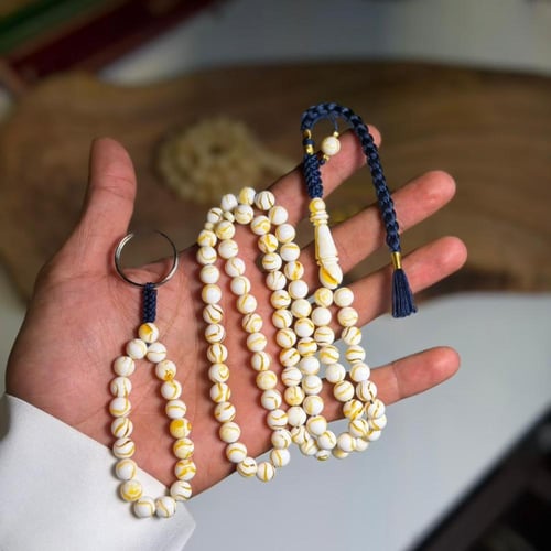 مسباح مستكة وميدالية شبيه للكهرمان