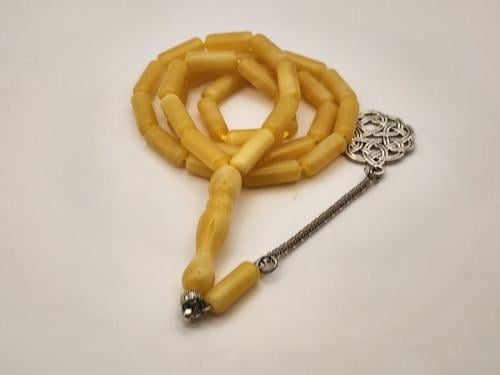 سبحه شبيه الكهرمان قص برميلي 33 خرزه 16 طول 6 عرض