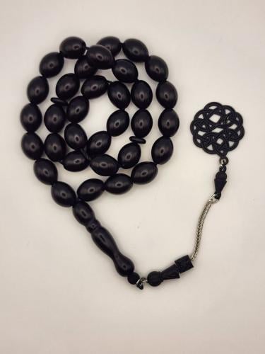 سبحه باللون الأسود مع طربزونه سوداء. 33 خرزه قص زي...