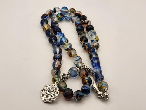 سبحه بكالايت 10 ملي 45 خرزه باللون الشفاف المموج