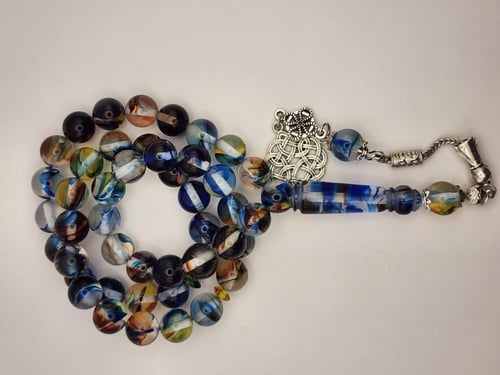 سبحه بكالايت 10 ملي 45 خرزه باللون الشفاف المموج