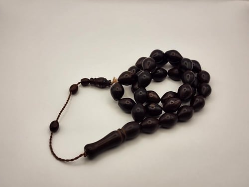 سبحه من خشب الكوك 33 خرزه قص زيتوني 13 طول 9 عرض